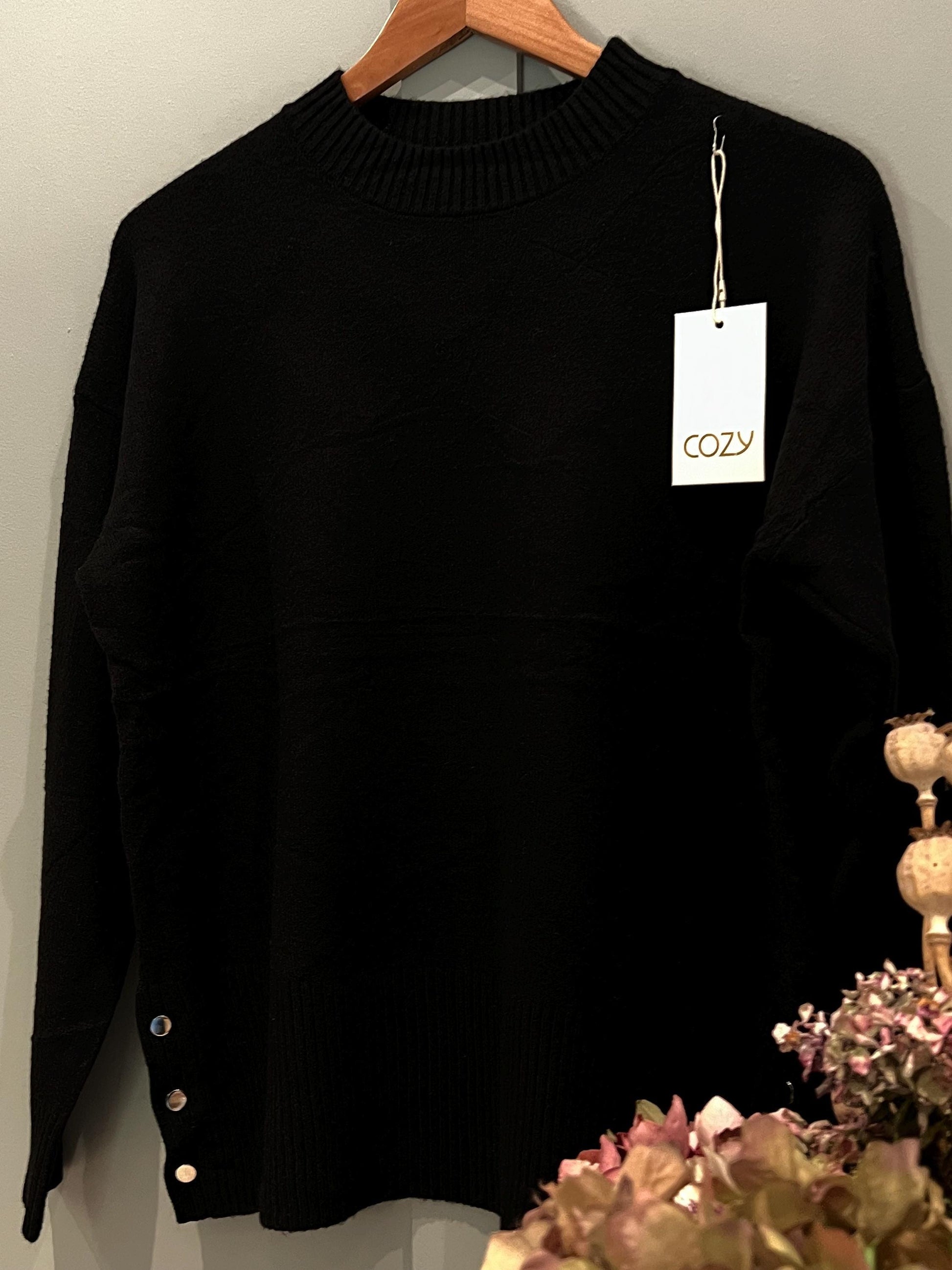 Black Ladies Jumper with Button Side Detailing. Stunning jumper with buttons on the side, One size fits most, Long Sleeved.