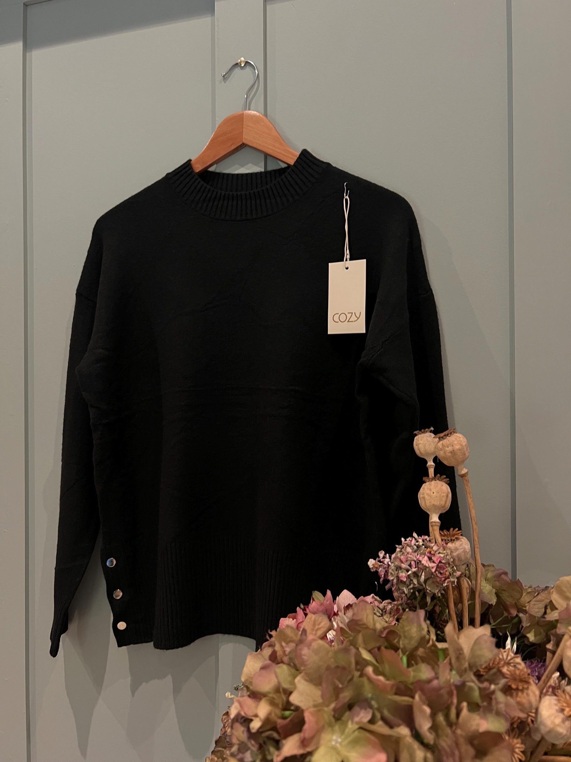 Black Ladies Jumper with Button Side Detailing. Stunning jumper with buttons on the side, One size fits most, Long Sleeved.