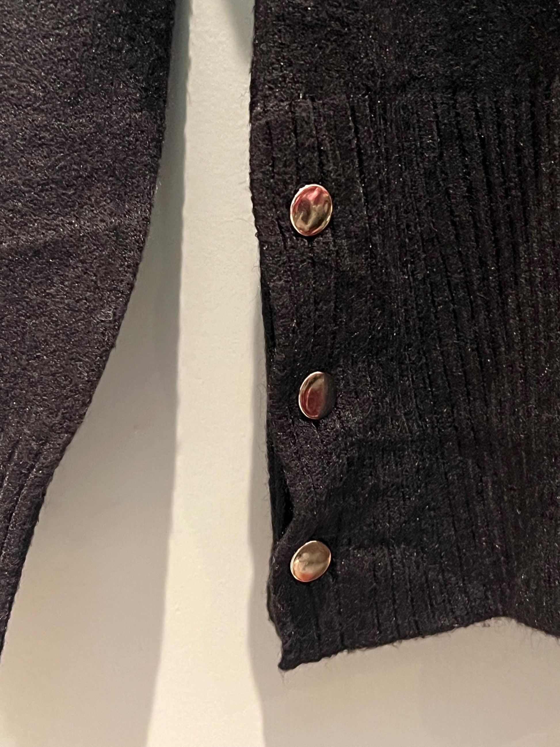 Black Ladies Jumper with Button Side Detailing. Stunning jumper with buttons on the side, One size fits most, Long Sleeved.