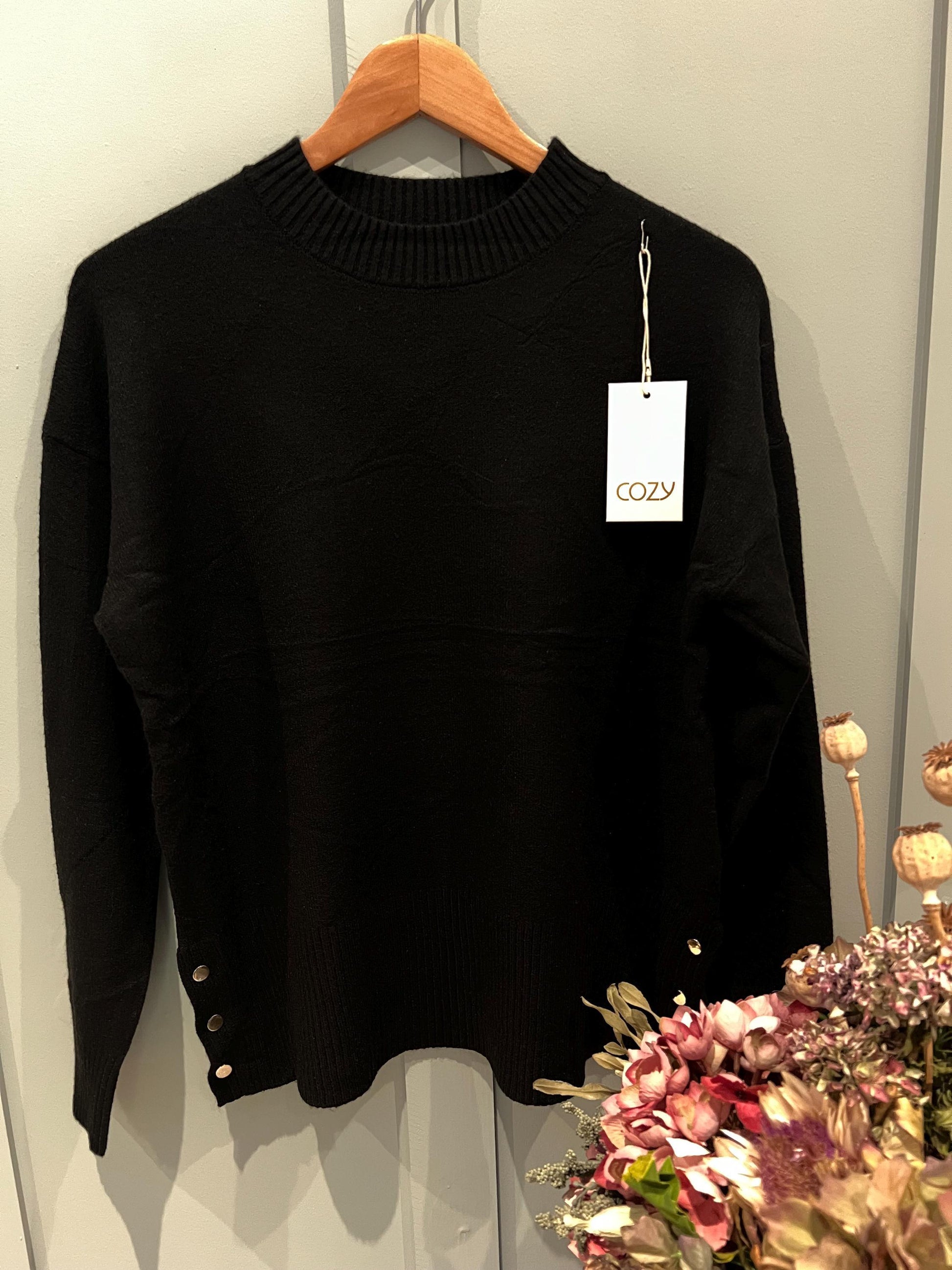 Black Ladies Jumper with Button Side Detailing. Stunning jumper with buttons on the side, One size fits most, Long Sleeved.