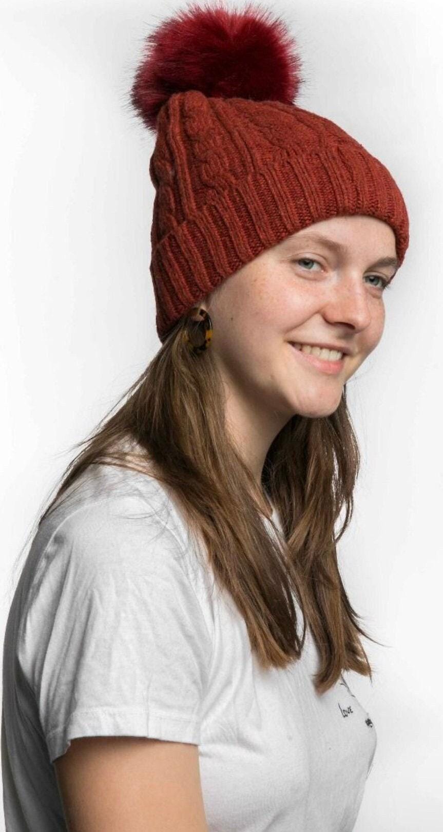 Cable knit hat with faux fur pompom