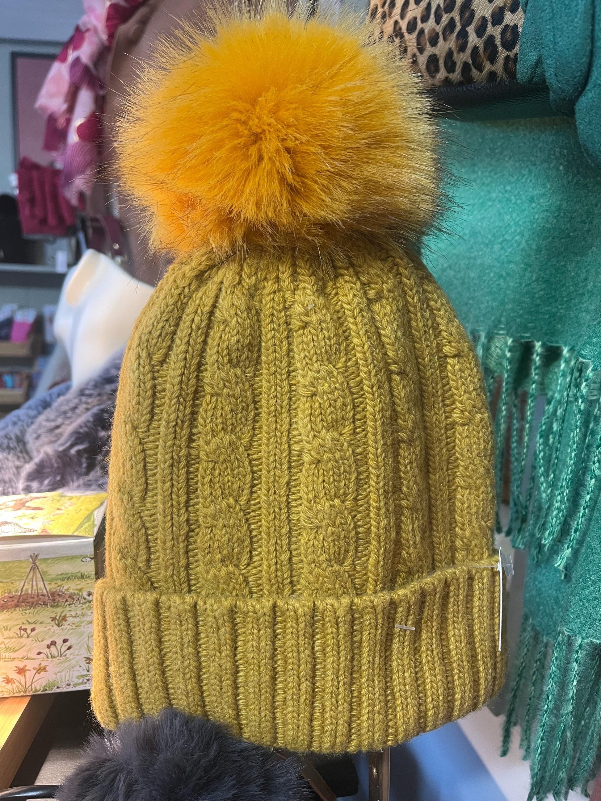 Cable knit hat with faux fur pompom